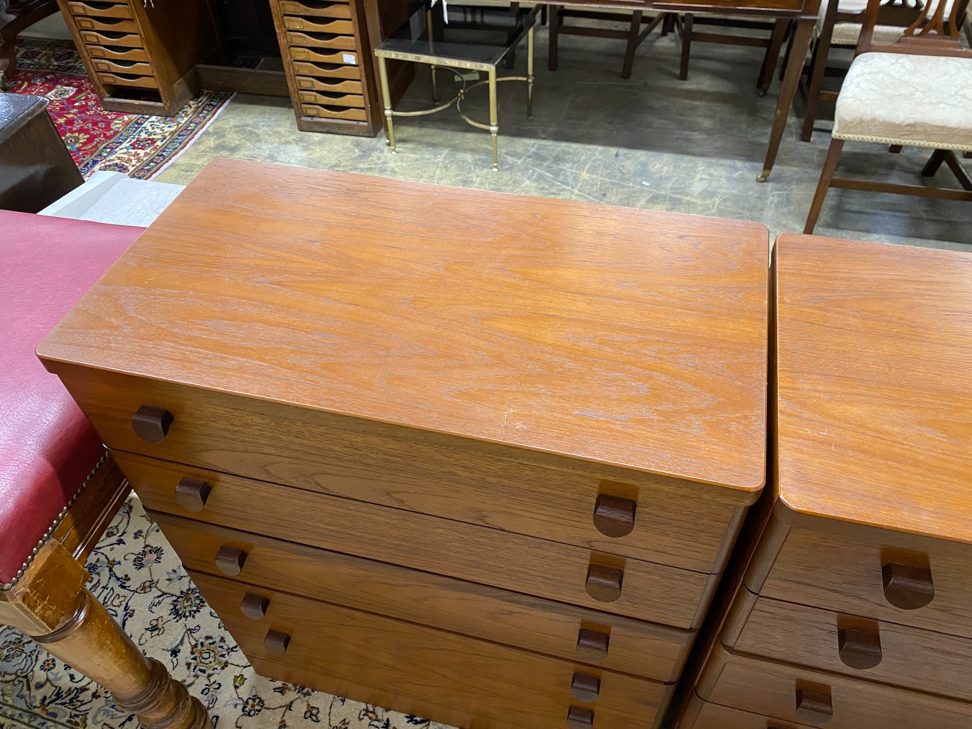 A pair of mid century Stag teak five drawer bedside chests, width 82cm, depth 44cm, height 96cm